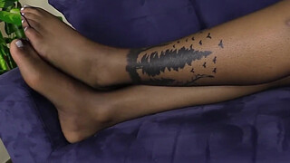 Blonde shemale shows her feet in black nylons